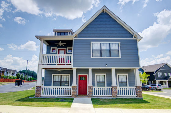 blue 2 story cottage house with red door. Links to blog about teal-time inspections.