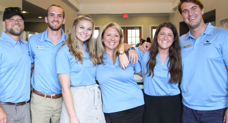 norman property staff in blue shirts
